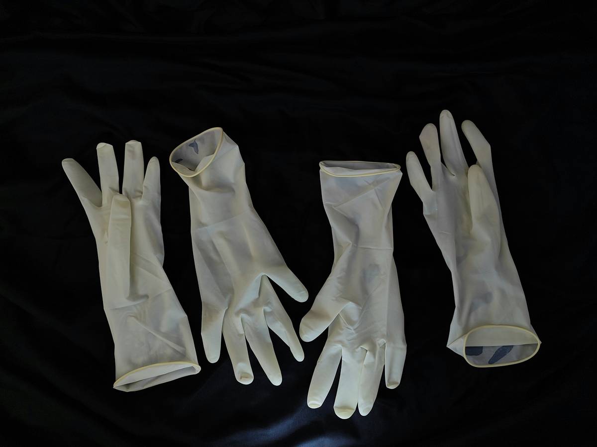 diaguru biodegradable gloves decomposing in home compost bin next to measuring tape showing 90-day timeline