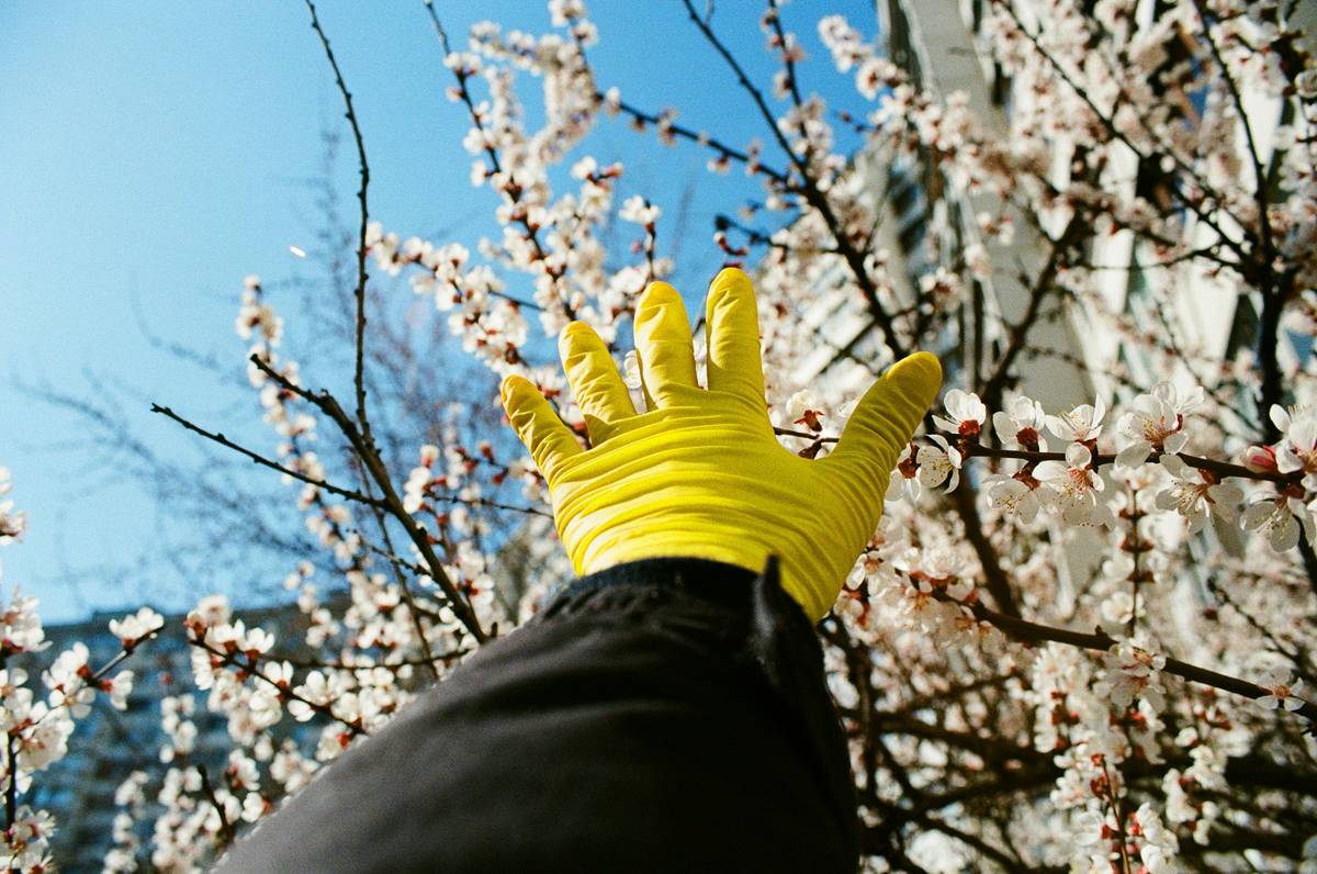 Close-up of chemical resistant work gloves being rinsed after use with household cleaners
