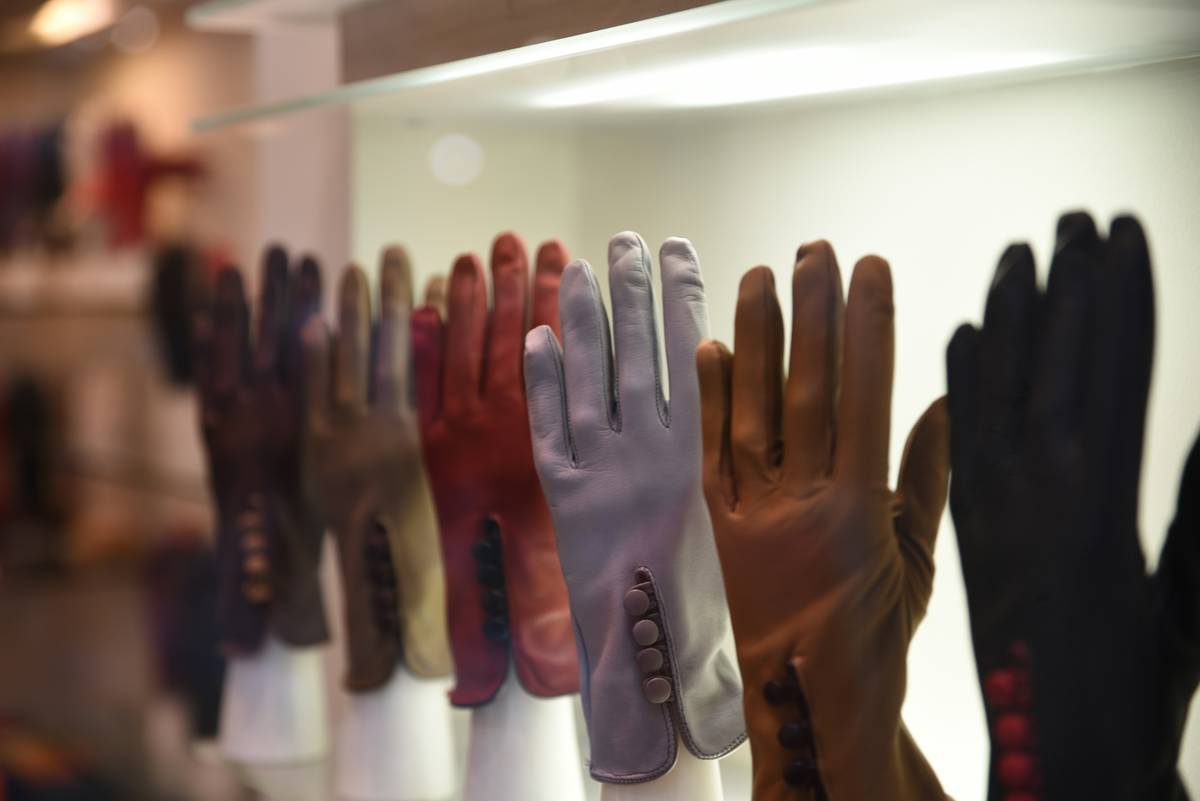Heat resistant safety gloves stored neatly in a sustainable kitchen drawer