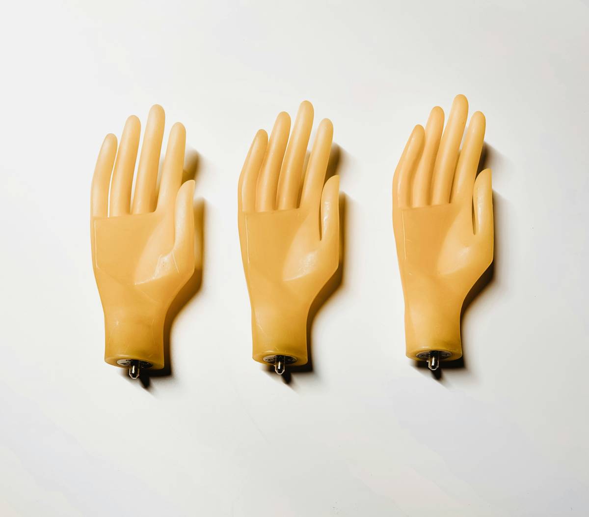 Close-up of rubberised chemical resistant long gloves showing textured grip and extended cuff